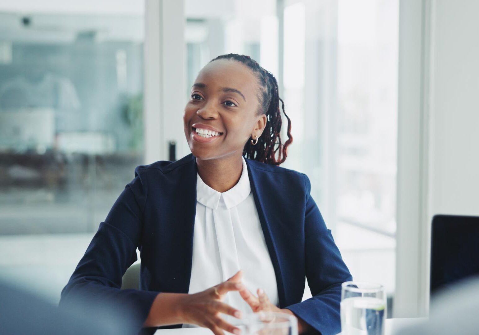 Smiling woman in a business meeting.