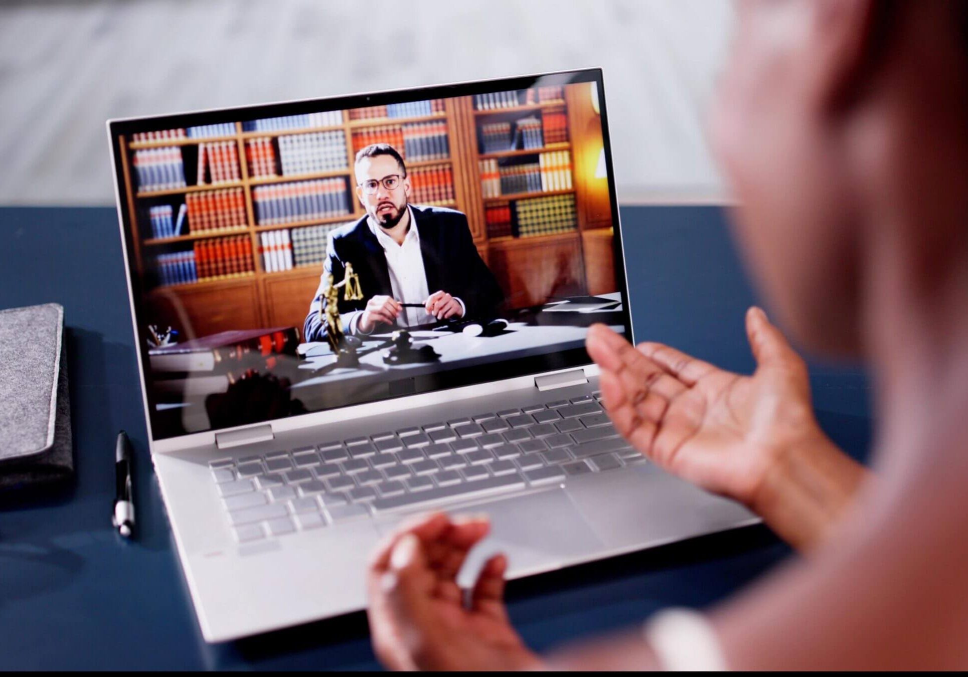 Video call on laptop with professional setting.
